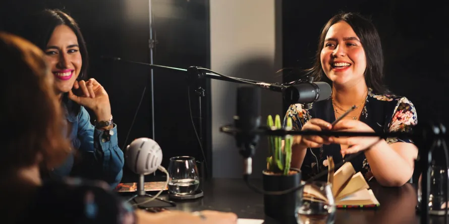 A group of women recording a podcast