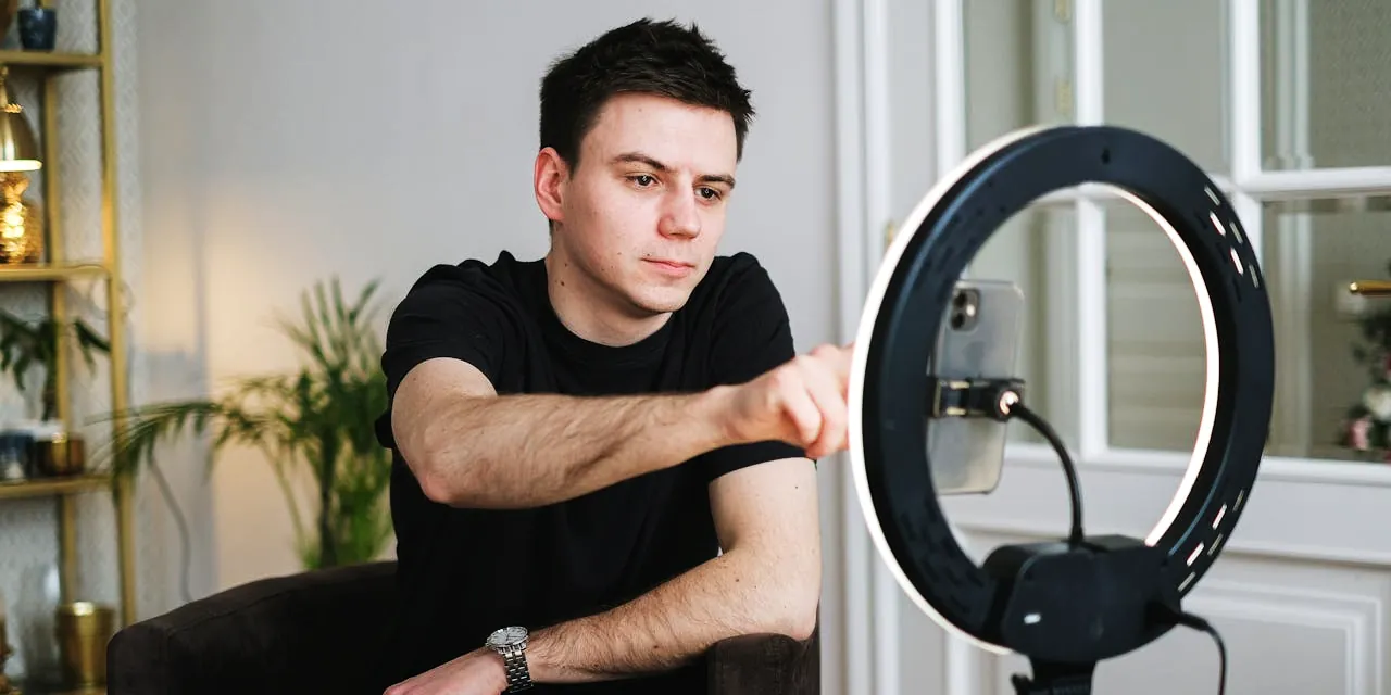 Young man recording a vlog